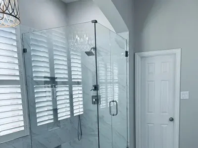 PaintMor Painters professional residential interior painters in Plano showing a modern cool white freshly painted bathroom in a home in Plano.