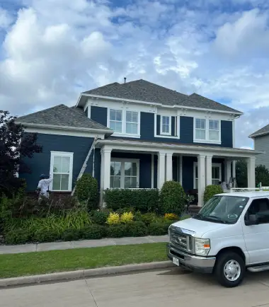 Front exterior of a North Texas home prepared for outdoor living season with fresh landscaping and inviting curb appeal.