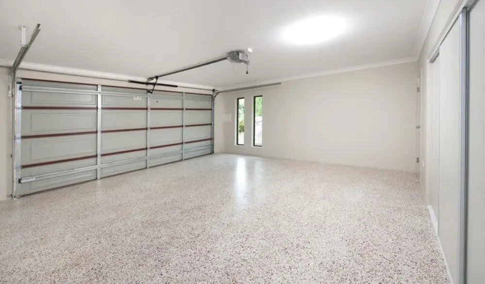paintmore painters photo of a white garage with speckled garage floor epoxy