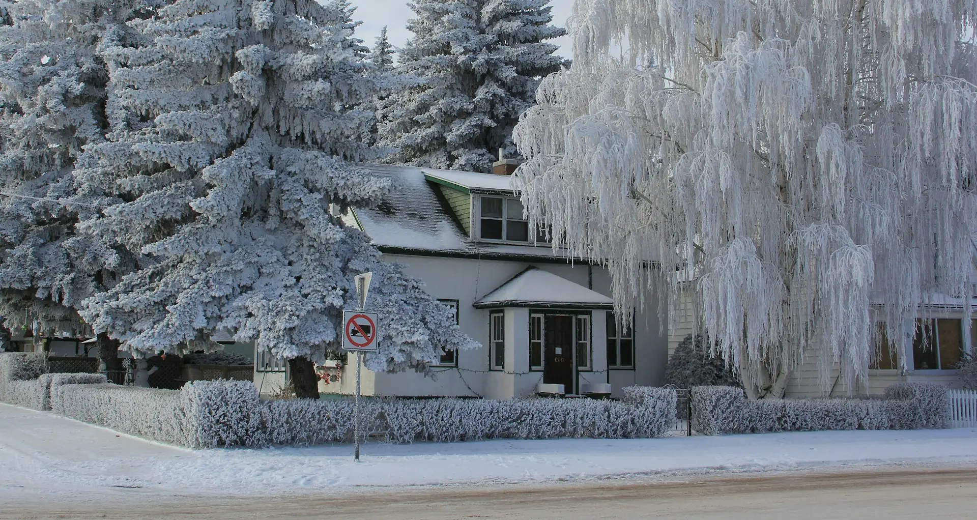 Protecting Your Home for Texas Winters image of frozen house very iced over in winter