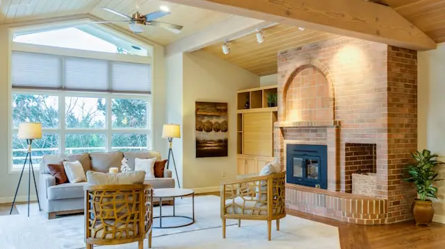 Uncluttered North Texas family room with light colors, indoor plants, and summer-friendly décor.