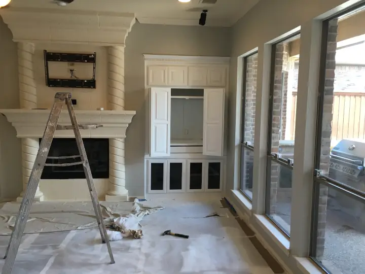 Detailed professionally prepped living room ready for painting